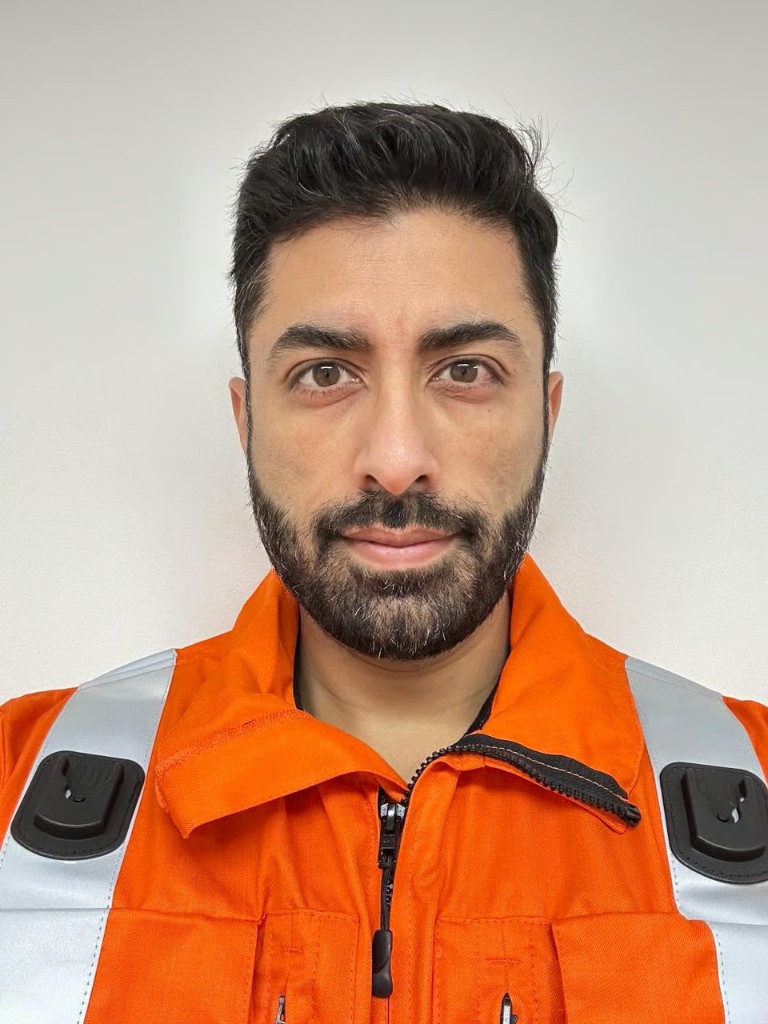 Dr Ali Husain in EMICS high-visibility uniform